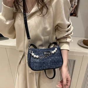 Fashionable dark blue denim crossbody bag with white polka dots and pearl flower chain