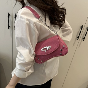 Chic pink asymmetric saddle bag with silver hardware on model for daily styling