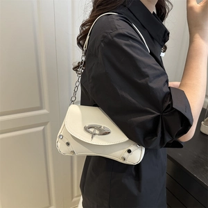 White leather shoulder bag with irregular silver metal buckle and rivets on model