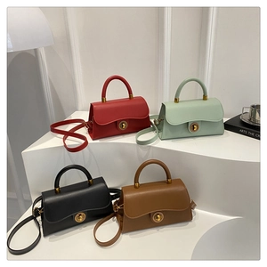 Detailed display of fashionable crossbody bags in four colors with gold round metal locks