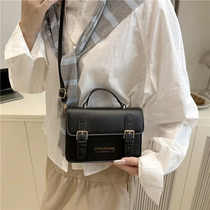 Chic black PU leather crossbody bag with buckle detail and top handle for women