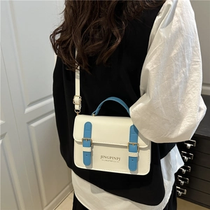 Minimalist white and blue contrast shoulder bag with metal buckles for summer
