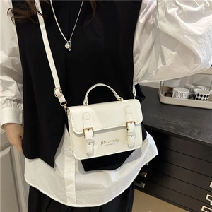 Chic white PU leather crossbody bag with double buckle straps for a trendy summer look