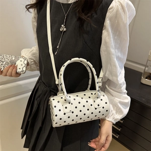 Minimalist white polka dot cylindrical crossbody bag with top handle for women