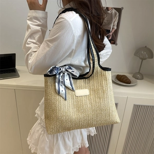 Chic woven straw tote bag with black leather trim and Paris print scarf decoration