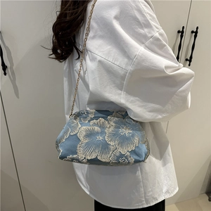 Elegant light blue floral jacquard crossbody bag with gold metal chain for women