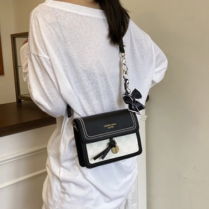 Stylish black and white square bag with plaid pattern and silk scarf strap