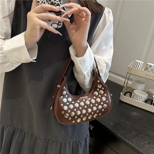 Brown faux leather crescent bag with silver stud accents and vintage y2k hobo style