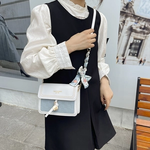 Fashionable blue checkered square crossbody bag with silk scarf handle and gold lettering