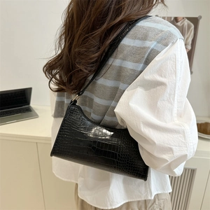 Retro black crocodile embossed shoulder bag for women with minimalist baguette design