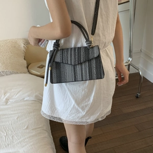 Minimalist woven striped crossbody bag for women with decorative knot and slim shoulder strap
