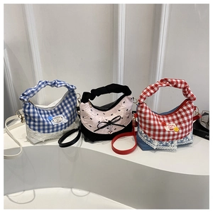 Detailed display of trendy bucket bags in plaid and floral patterns with lace trim