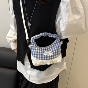 Blue gingham bucket bag with white lace trim and adjustable shoulder strap for women