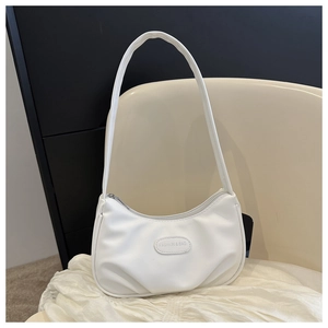 Detailed view of the white PU leather underarm bag featuring a FASHION & BAG leather patch