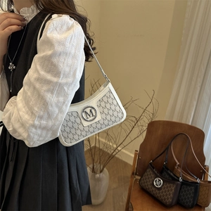 French vintage underarm bag with M-letter print and silver metal buckle in white