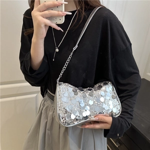 Silver sequin shoulder bag with chain strap shown in a stylish mirror selfie fashion