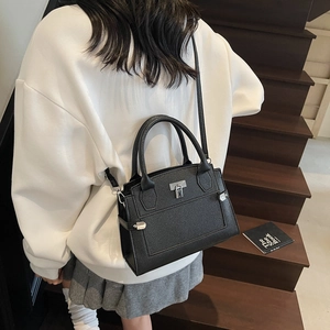 Minimalist black lychee texture leather handbag with silver lock and shoulder strap