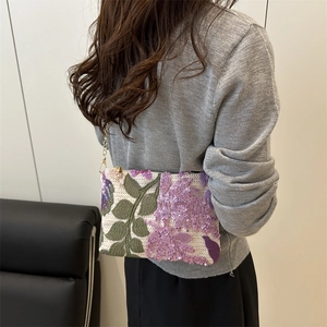 Elegant square crossbody bag with purple sequin floral embroidery and gold chain strap