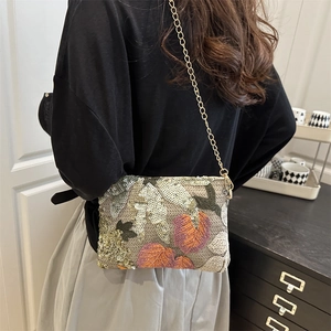 Elegant rectangular handbag featuring colorful sequin leaf embroidery and golden chain strap