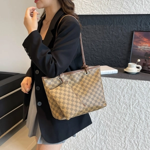 Chic checkered tote bag with matching pouch and long straps for a trendy urban look