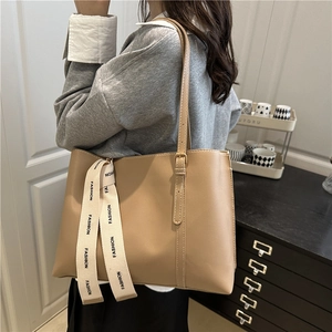 Minimalist beige PU leather tote bag for women with fashion ribbon and gold hardware