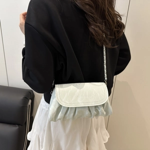 Chic light green cloud bag with pleated texture and stylish metal chain strap