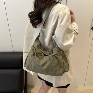 Olive green large capacity nylon tote bag with side bow detail for casual commuting