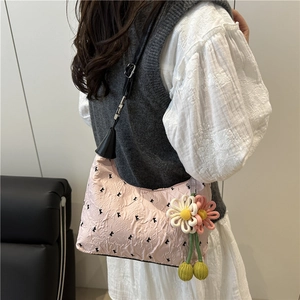Pink bubble texture hobo bag with black bow embroidery and daisy charm for women
