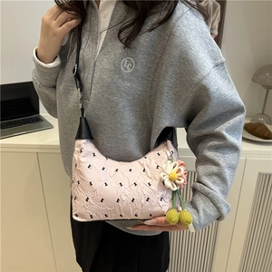Pink pleated crossbody bag with black embroidery and handmade flower charm accessory
