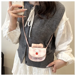 Pink plaid mini crossbody bag with cartoon puppy print and bow decoration on model