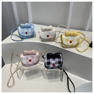 Mini crossbody bags with cartoon dog print and bow detail in five pastel colors