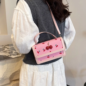 Pink crossbody bag with cherry prints and 3D crystal cherry charm on flap for women