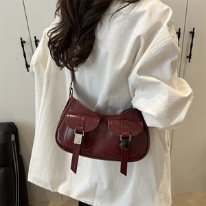 Chic burgundy faux leather shoulder bag with vintage dual pockets and metallic buckles
