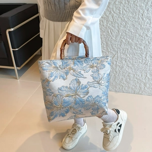 Women's chic light blue floral bucket bag with vintage natural bamboo handles