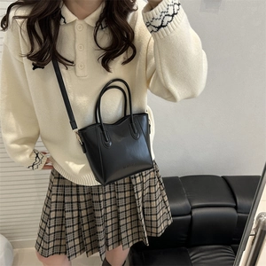 Minimalist black PU leather crossbody bucket bag with fashion embossed logo for women