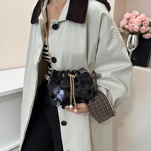 Fashionable black sequin bucket bag with gold chain strap and pearl detail for women