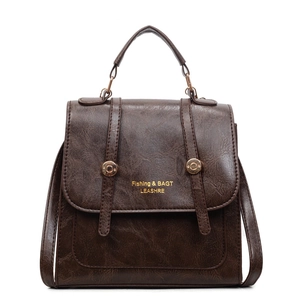 Deep brown retro faux leather backpack with gold lettering and metallic buckle details