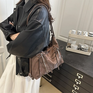 Vintage brown shoulder tote bag with metallic zippers and bow details for women