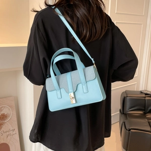 Elegant sky blue handbag with denim flap and metal twist lock for daily commuting