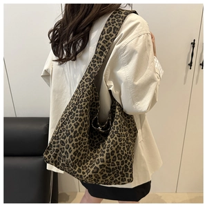 Close-up of hobo shoulder bag featuring classic leopard print pattern and spacious canvas design