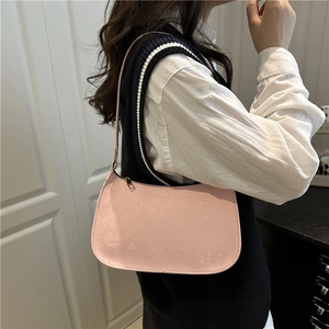 Pink faux leather hobo shoulder bag with snakeskin texture and minimalist design