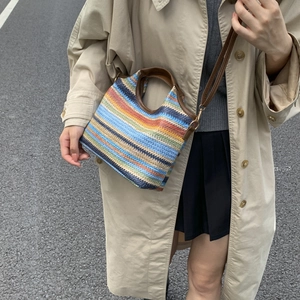 Multicolor striped woven bucket bag with brown leather strap for autumn casual style
