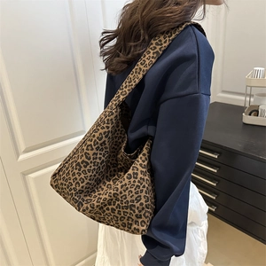 Minimalist large leopard print tote bag for women showing crossbody fit and size