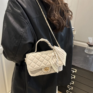 Quilted crossbody bag in beige with gold chain strap and silk scarf handle detail