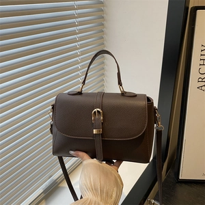 Minimalist dark brown litchi pattern leather handbag with gold buckle and crossbody strap