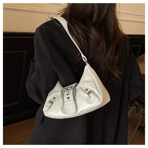 Detail of white glossy leather hobo bag featuring large metal buckle and pleated design