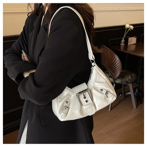 Detail of white glossy leather hobo bag with pleated texture and silver buckle