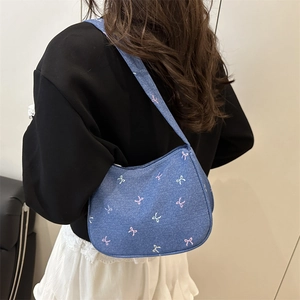 Blue denim hobo shoulder bag with colorful embroidered bow patterns for women