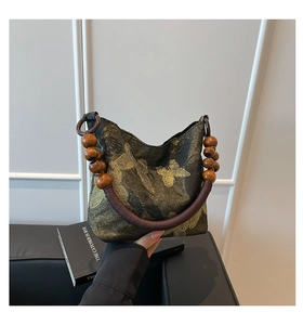 Chic handbag with golden moth prints and unique wooden bead woven handles detail