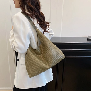 Green woven hobo shoulder bag with a textured finish for a minimalist casual look